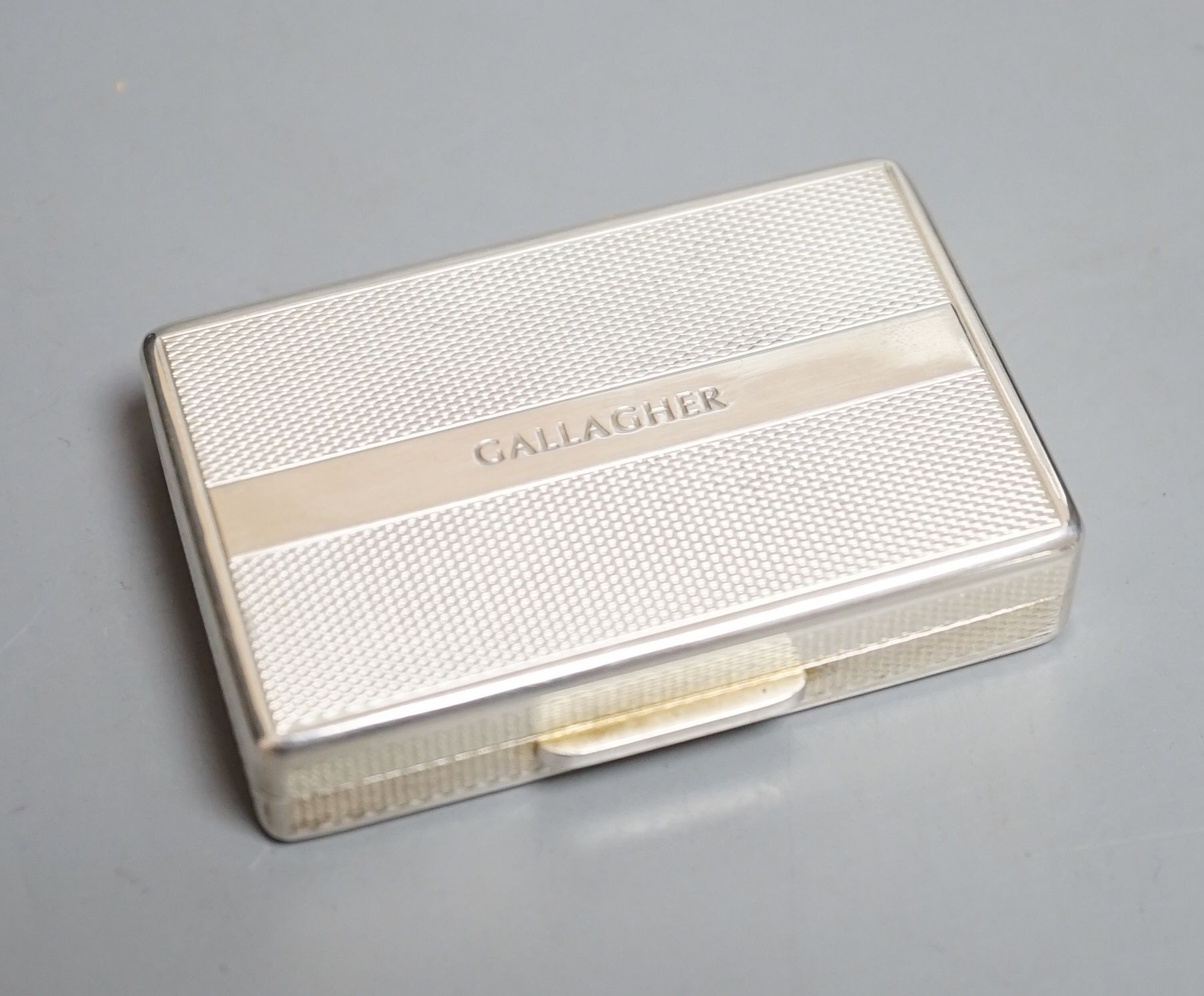 A modern cased engine turned silver rectangular pill box, by Peter John Doherty, London, 2007, 64mm, engraved 'Gallagher' on the base, in a Richard Jarvis of Pall Mall box.